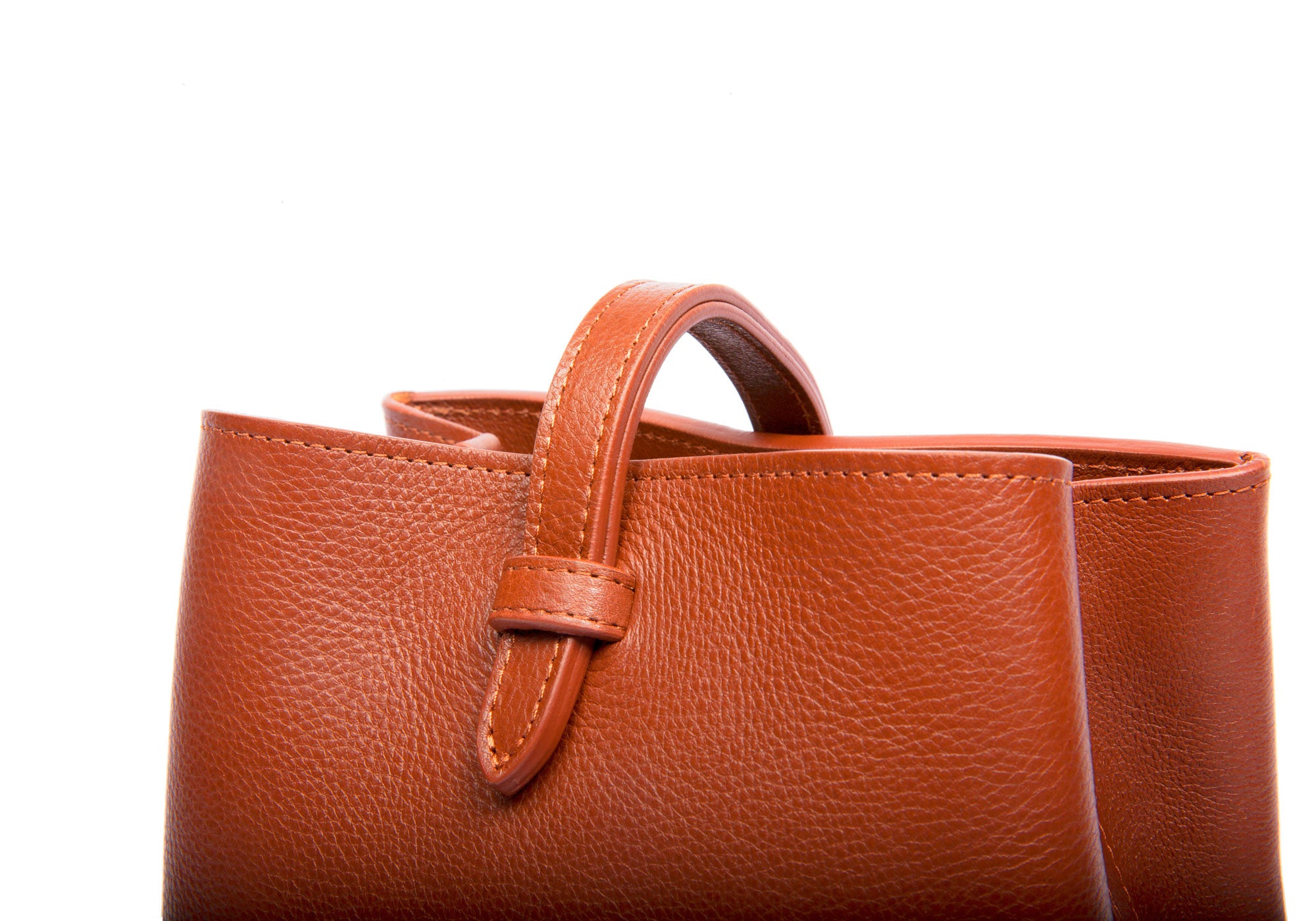The Mini Sling Backpack Saddle Tan